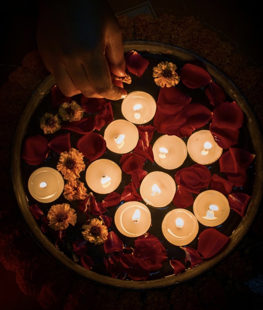 Floating candles and flower petals for ceremony
