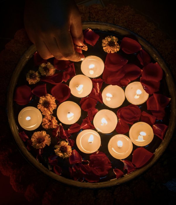 Floating candles and flower petals for ceremony